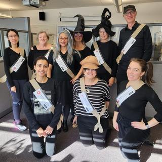 People dressed in black and white as error codes for Halloween