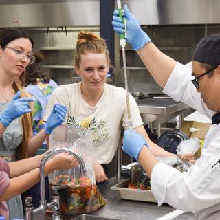 Four VIU microbiology and culinary arts work on their fermented seaweed products.