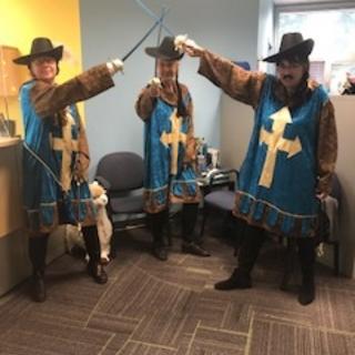 People dressed up as the Three Muskateers 