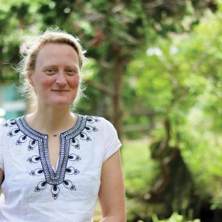 Jenni Ottilie Keppler stands on the koi pond bridge at Vancouver Island University's Nanaimo campus.