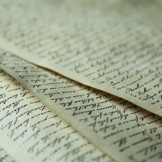 Sheets of paper with writing on them