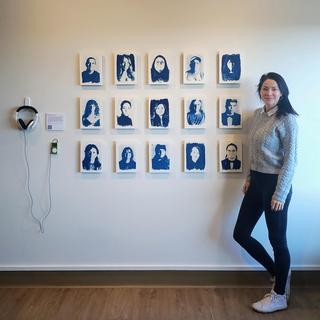 Tarah Dowling stands next to her exhibit.