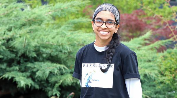 Becky stands in front of greenery at VIU's Nanaimo campus