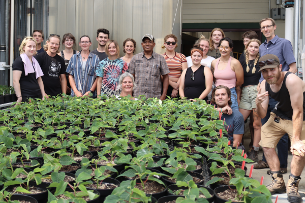 VIU Horticulture students in front of plants inside greenhouse