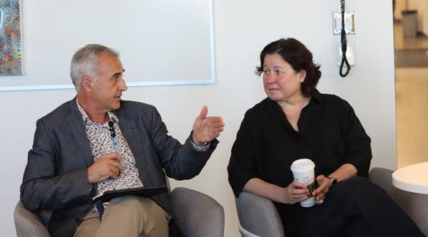 two people seated talk to one another, on the left is VIU Provost and Vice-President Academic Dr. Michael Quinn, on the right is VIU President and Vice-Chancellor Dr. Deborah Saucier