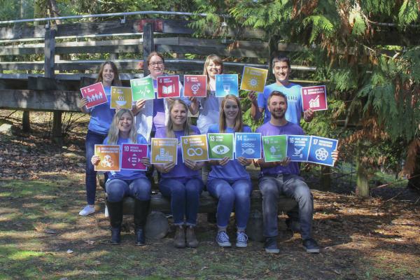 Members of MABRRI hold sustainable Development Goal icons.