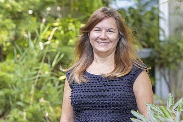 Monique McKay surrounded by greenery