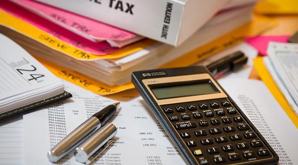 calculator and spreadsheets on a desk