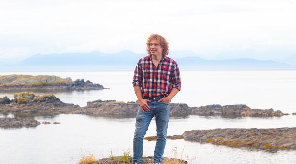 Ted with the ocean behind him