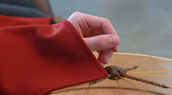 Hand holding a drum