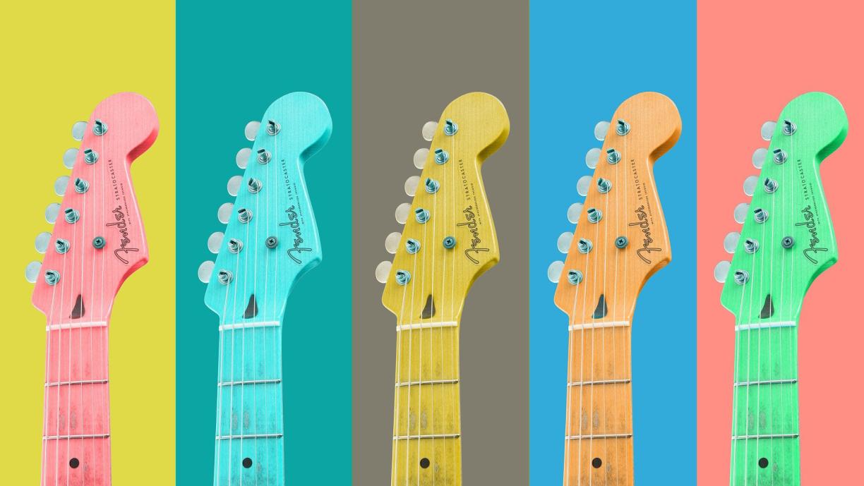 The top half of guitars pictured against yellow, green, grey, blue and peach backgrounds.