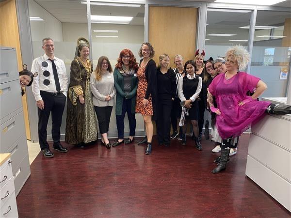 People in an office setting dressed up for Halloween