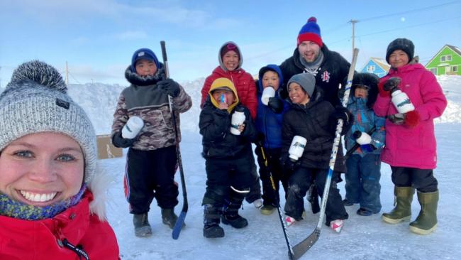 Group shot of people with hockey equipment